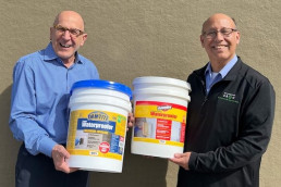 SBDC Client, Ken, and his International Trade Consultant, Brent, holding his product Damtite product.